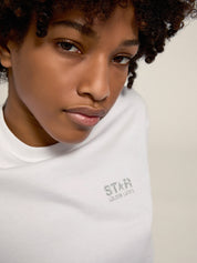 Women's white T-shirt with silver glitter logo and star